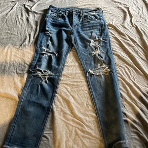 Tom girl American eagle distressed, high-rise skinny jeans